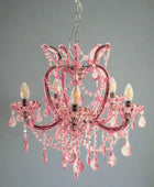 Pink chandelier with crystal accents on a white background