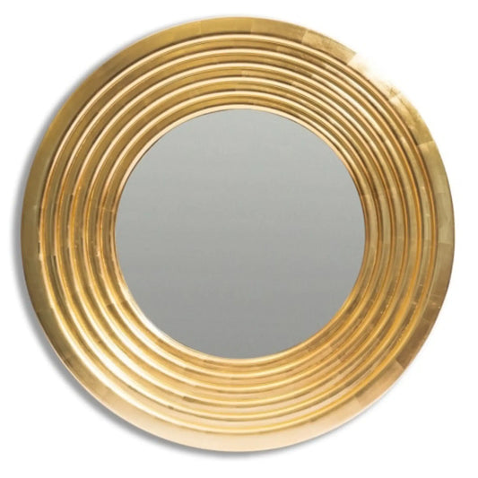 Round gold-framed mirror on a white background