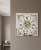 Decorative wall clock with Roman numerals on a beige wall.