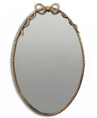 Decorative oval mirror with a gold frame on a white background
