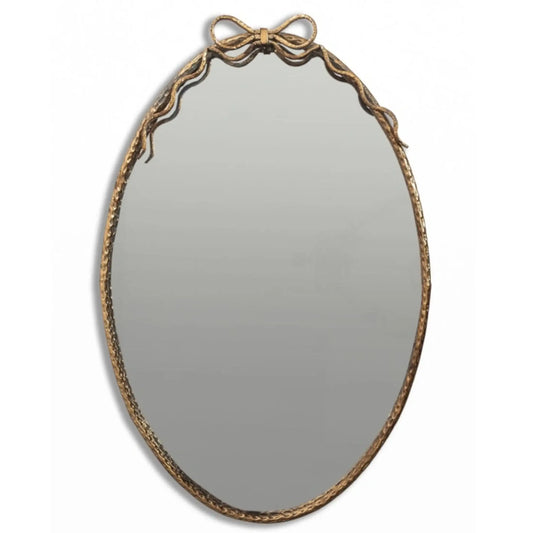 Decorative oval mirror with a gold frame on a white background