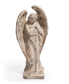 Statue of an angel with closed eyes and hands clasped, on a white background