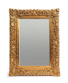 Decorative gold-framed mirror on a white background