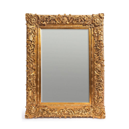 Decorative gold-framed mirror on a white background