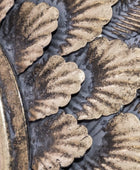 Close-up of decorative metalwork with leaf patterns
