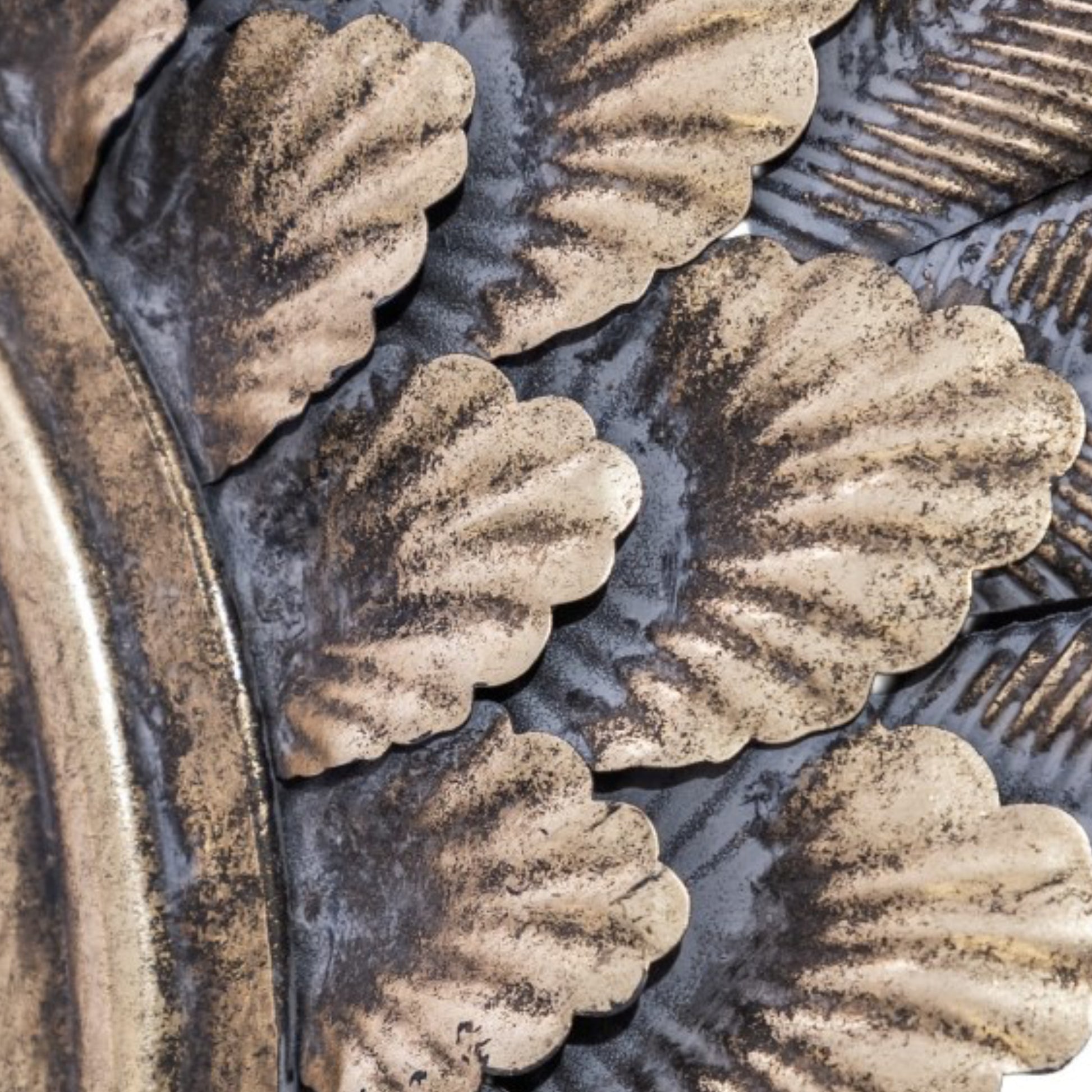 Close-up of decorative metalwork with leaf patterns