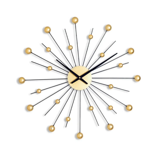 Decorative wall clock with gold accents on a white background