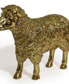 A metallic gold sheep figurine with textured wool and a polished finish, standing on a white background.