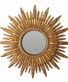 Gold sunburst mirror on a white background