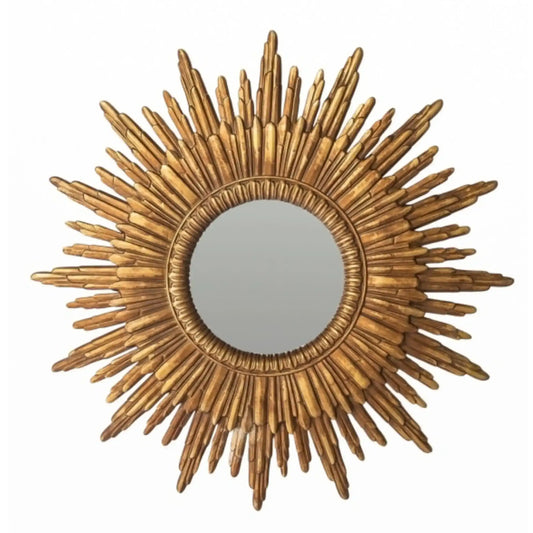 Gold sunburst mirror on a white background