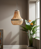 Woven pendant light fixture hanging in a room with a plant and window.