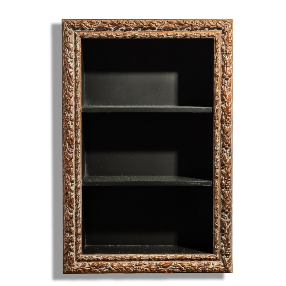 An ornate rectangular wall-mounted shelf with a carved brown and gold frame, three black shelves, and a black backing, shown against a white background.