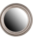 Round mirror with a silver frame on a white background