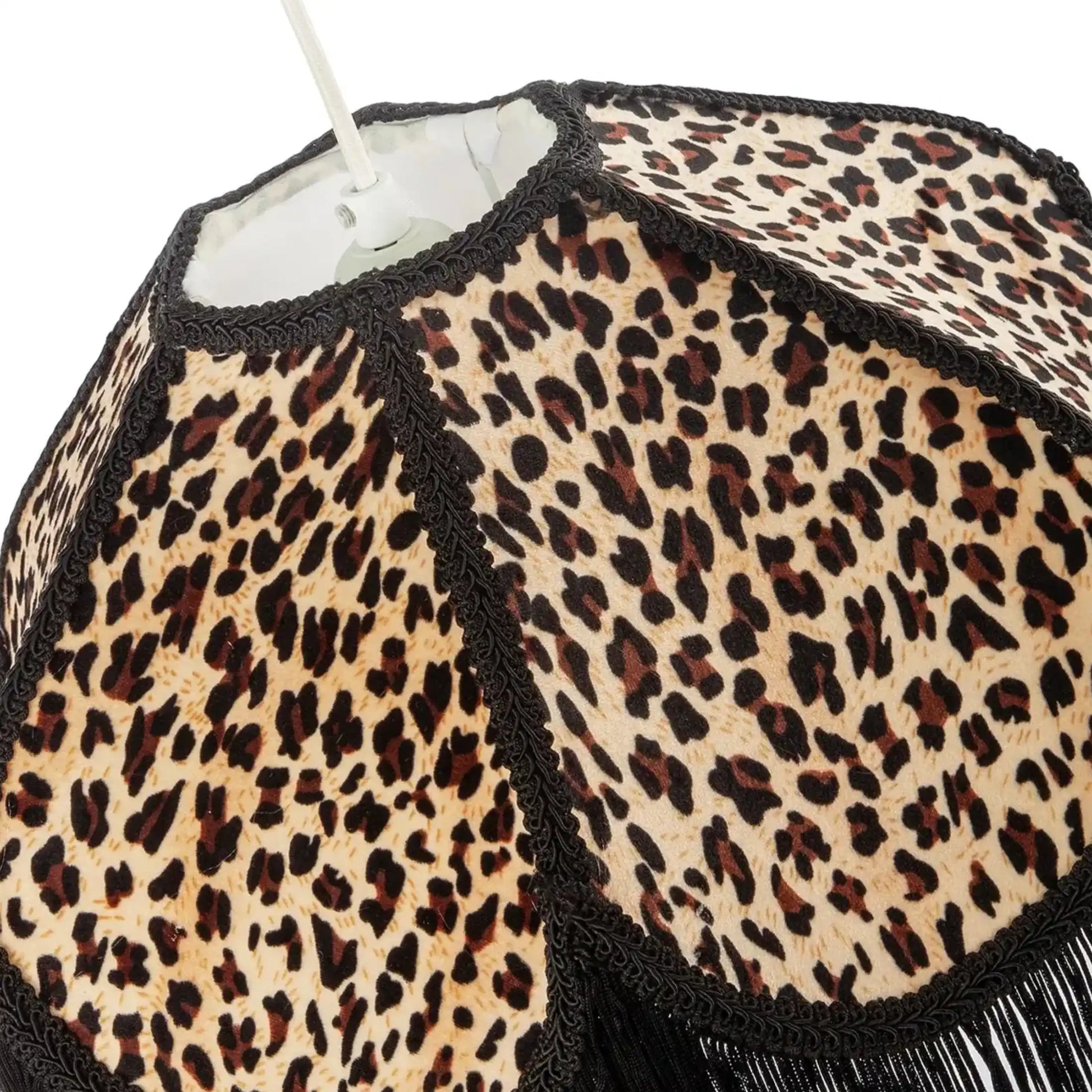 Leopard print lampshade with black trim on a white background