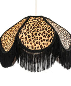 Leopard print lampshade with black fringes on a white background
