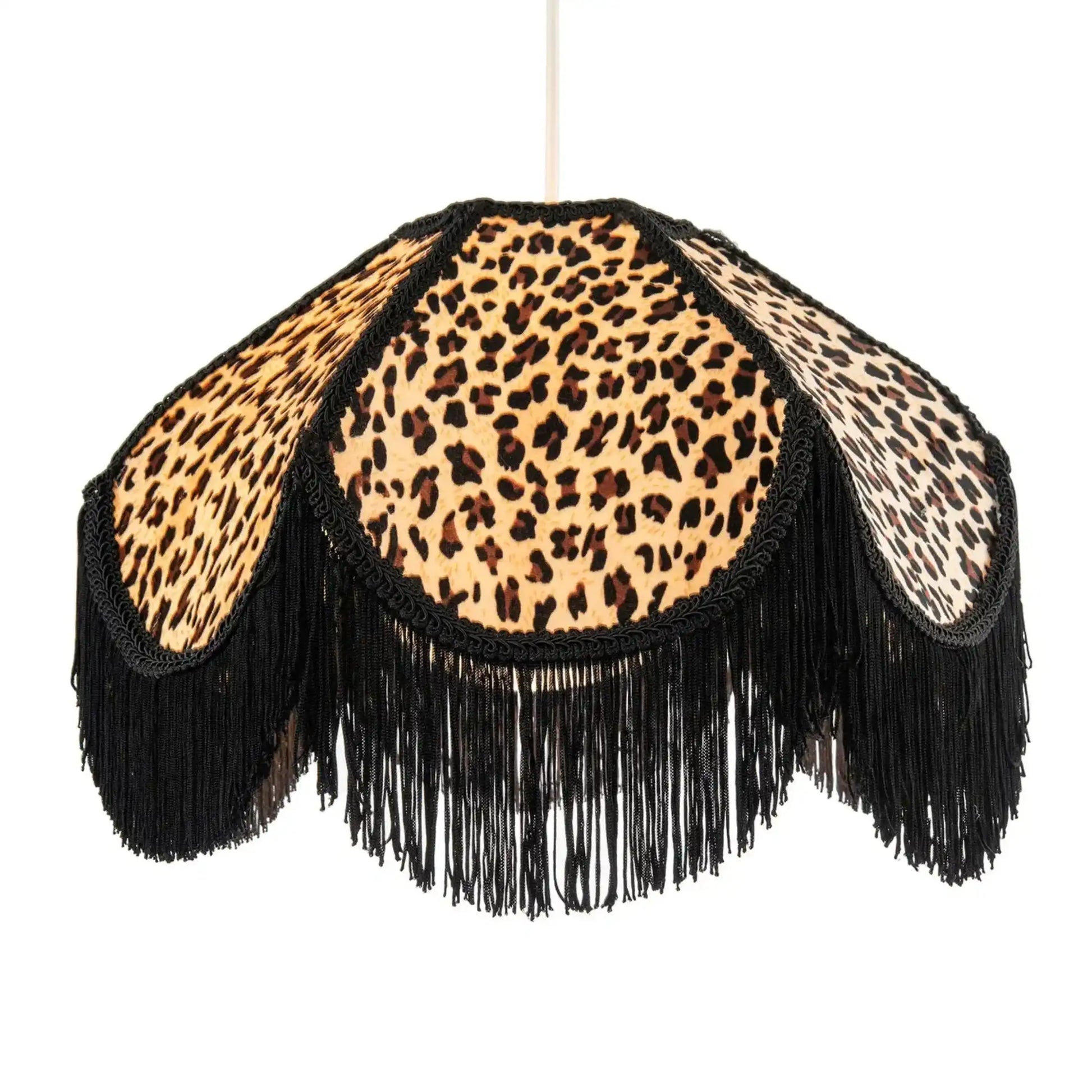 Leopard print lampshade with black fringes on a white background