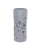 Gray cylindrical lantern with butterfly patterns on a white background