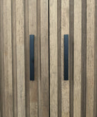 Wooden panel with two black rectangular handles