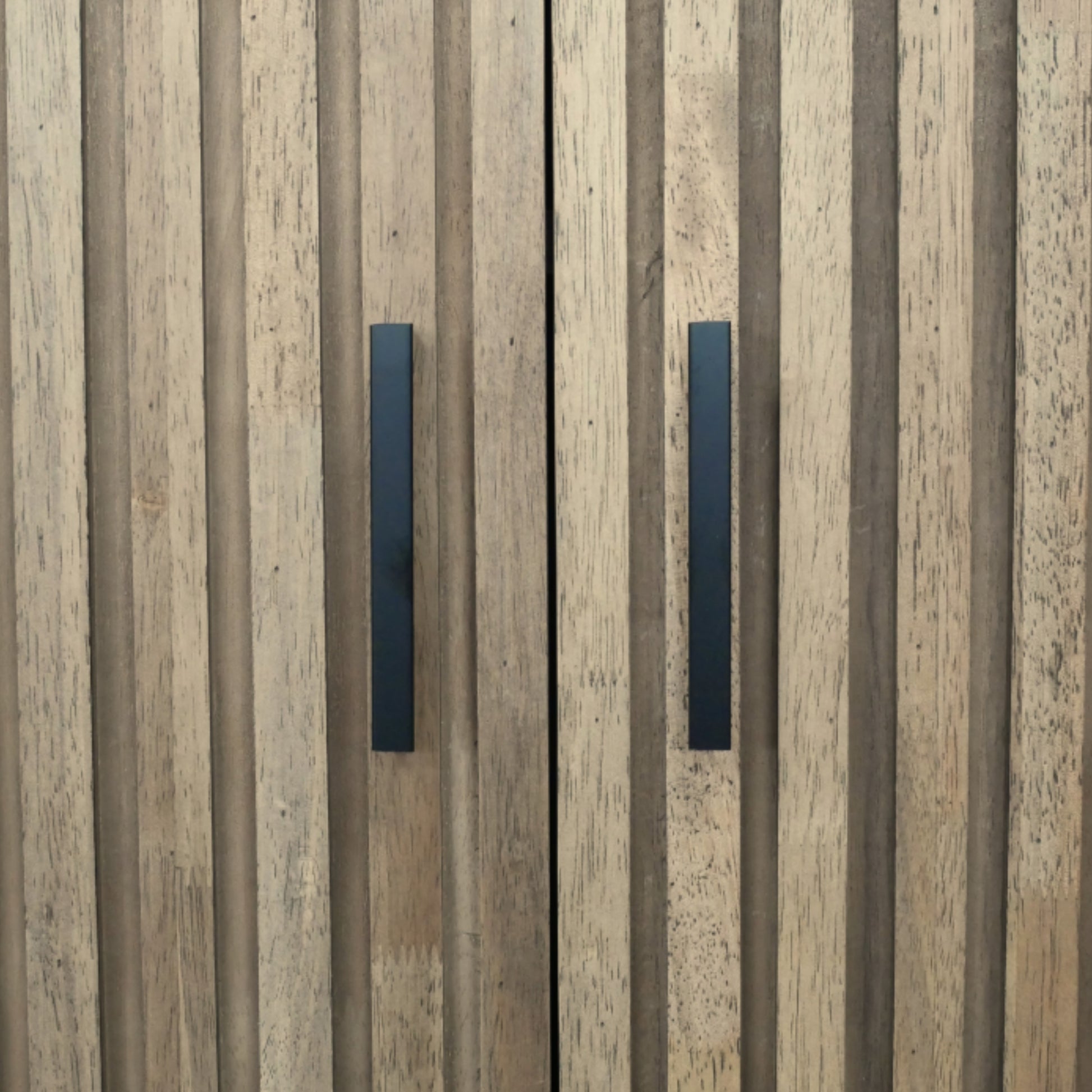 Wooden panel with two black rectangular handles