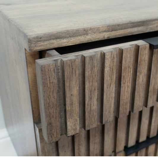 Wooden cabinet with slatted design on a white background