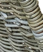 Close-up of woven rattan chair with natural brown tones