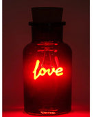 A dark glass bottle with a cork stopper, illuminated from within by a glowing red neon-style 'love' sign, set against a dark red background.