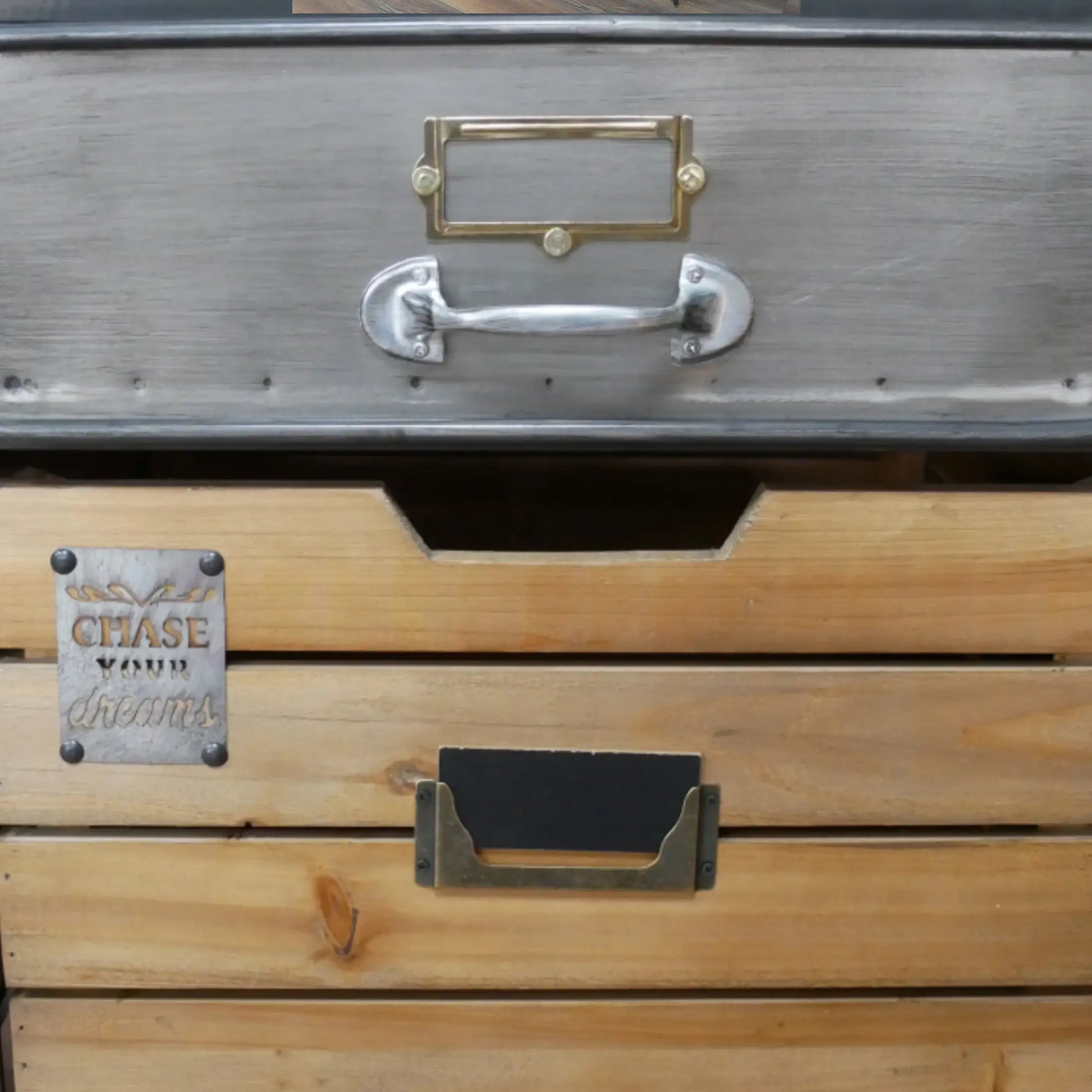 Wooden drawer set with metal handles and 'Chase' branding on a wooden surface.