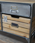 Wooden dresser with metal accents on a wooden floor