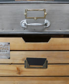 Wooden drawer set with metal handles and 'Chase' branding on a wooden surface.