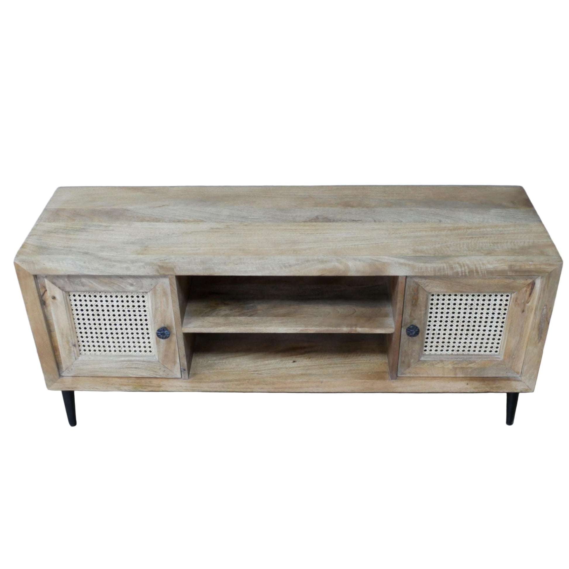 Wooden TV stand with rattan doors on a wooden floor against a gray wall.