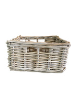 Wicker basket on a dark surface with a neutral background