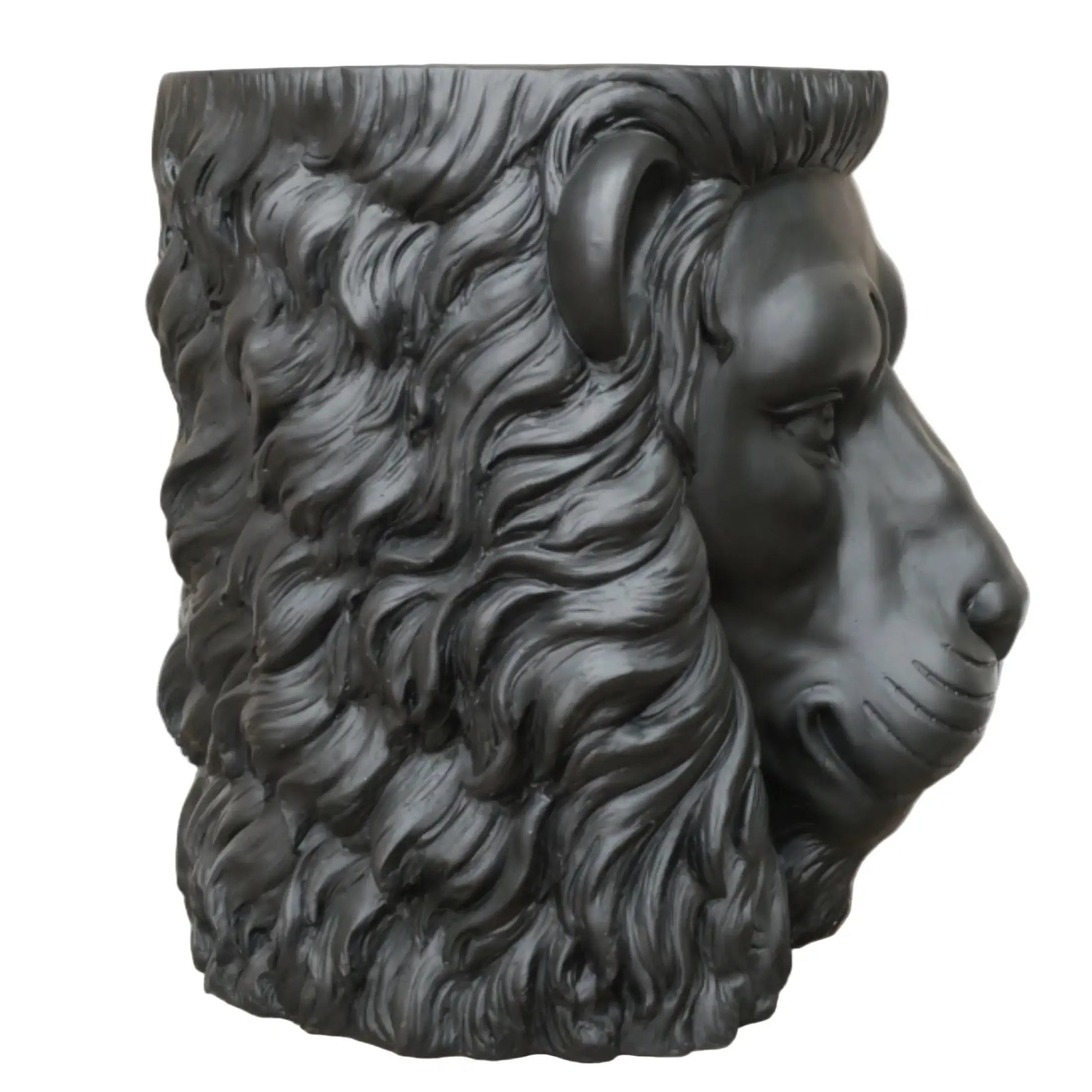 Black ram head sculpture on a wooden surface