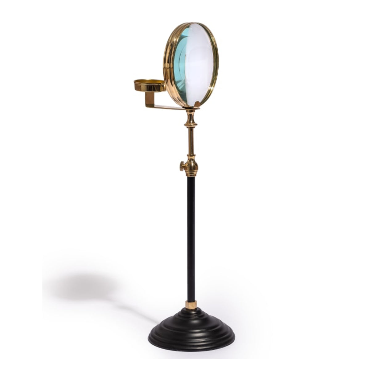 A vintage-style adjustable optical stand with a black pole, brass metal components, and a circular glass lens, shown on a white background with a soft shadow.