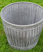 Decorative metal planter on grass