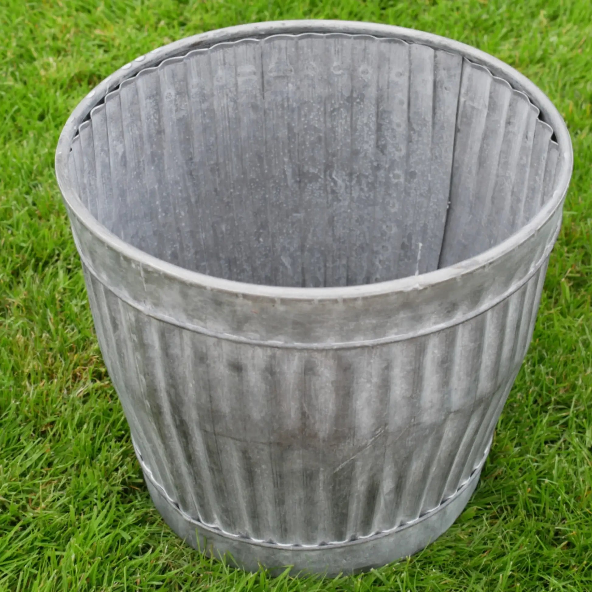 Decorative metal planter on grass