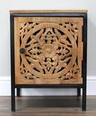 Wooden cabinet with intricate carvings on a white background