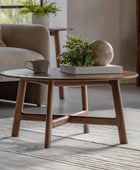 Wooden coffee table with decorative items in a living room setting
