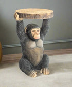 Monkey figurine holding a wooden platform on a white background