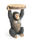 Monkey figurine holding a wooden platform on a white background