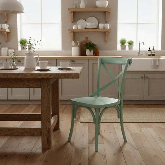 Kitchen with wooden table and green chair, shelves with kitchenware, and a sink.