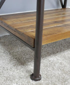 Wooden shelf with metal legs on a carpeted floor