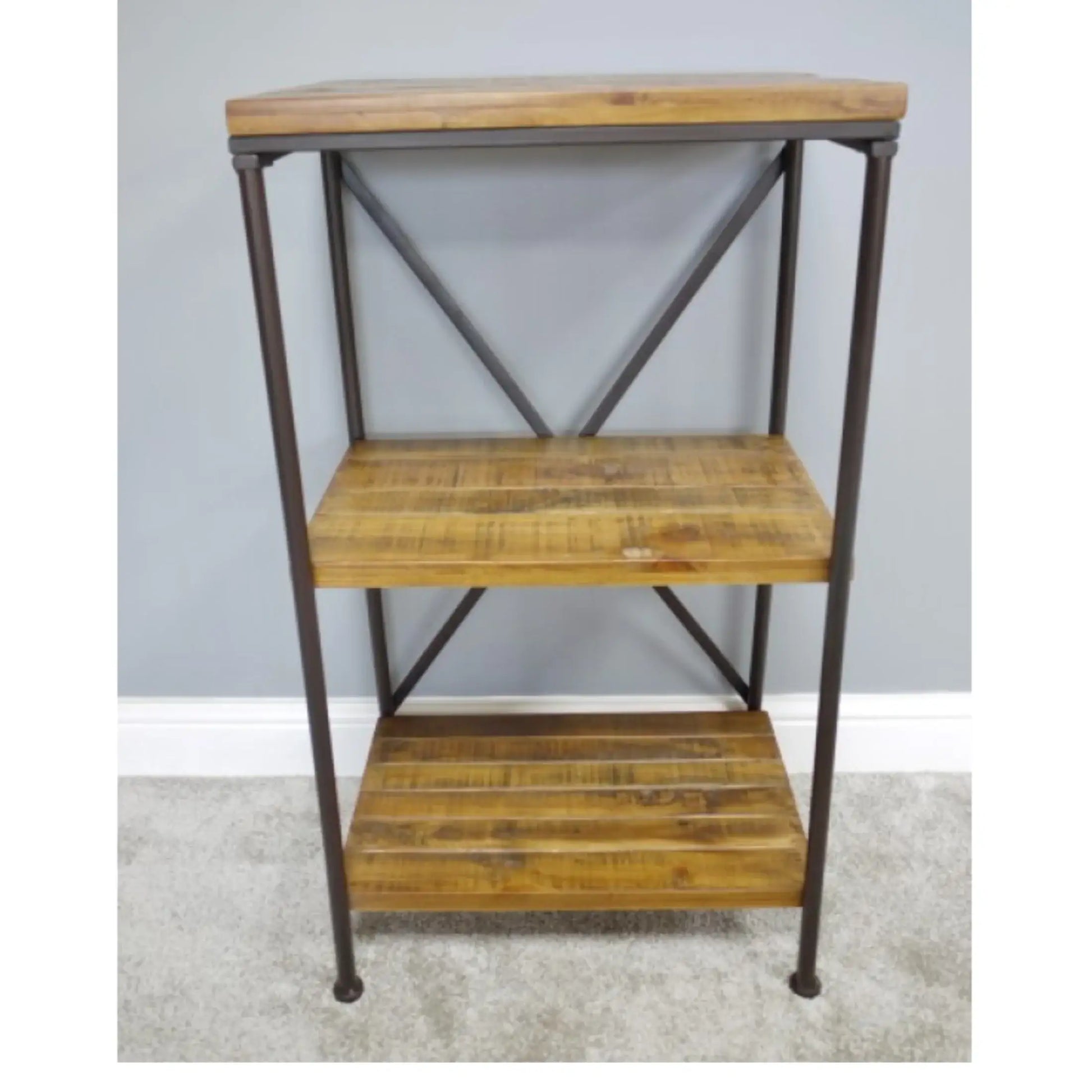 Three-tiered wooden shelf with metal frame against a gray wall.