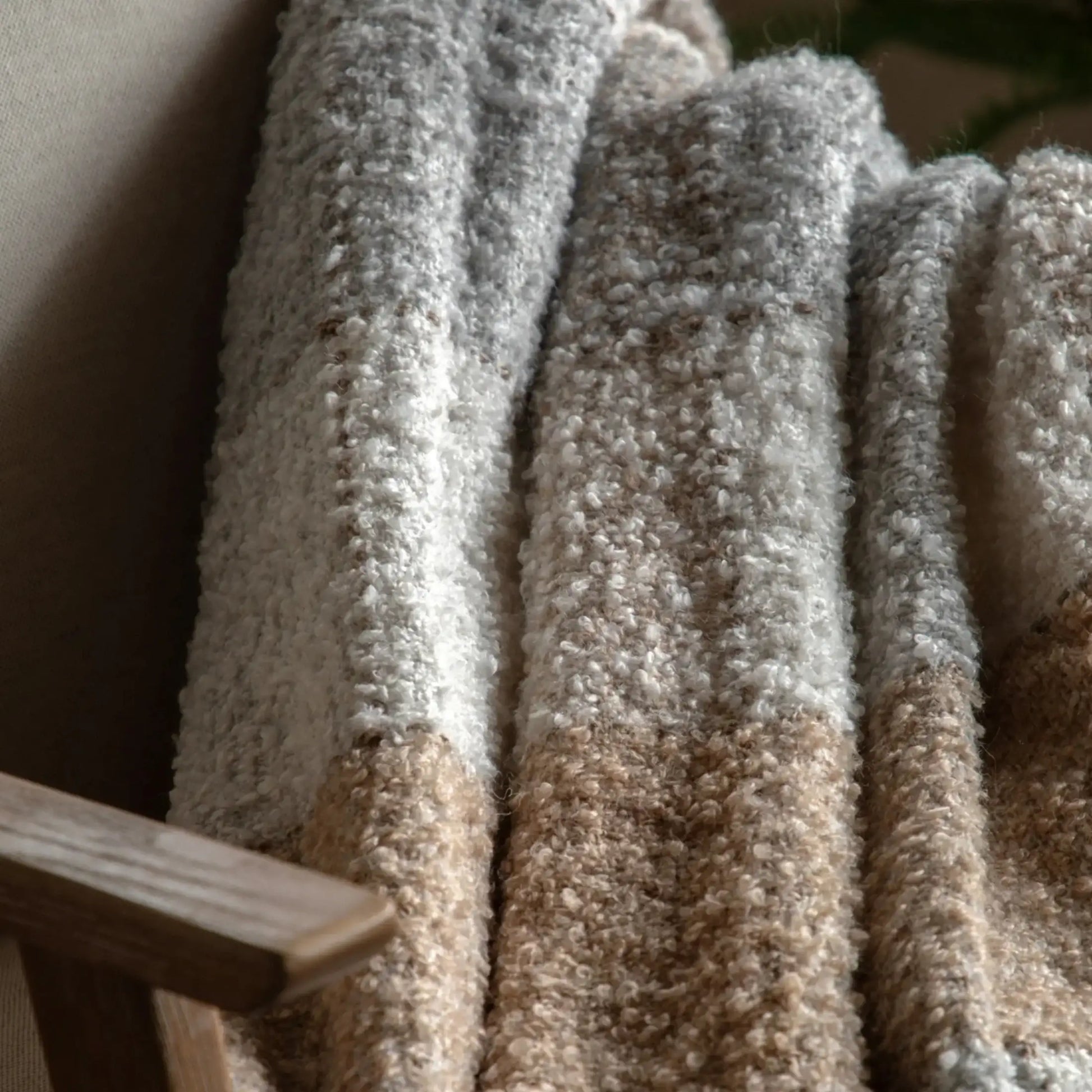 Close-up of carpet samples in various shades of brown and beige.