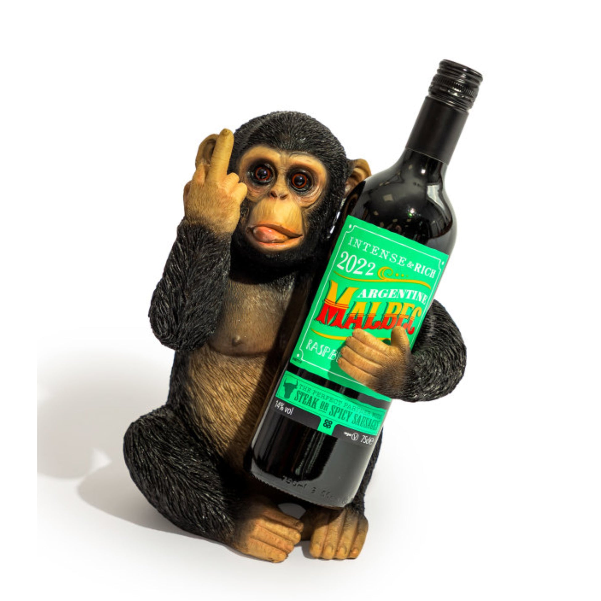 A novelty figurine of a seated chimpanzee holding a large wine bottle. The bottle has a green label that reads 'INTENSE & RICH ARGENTINA MALTED MALTED MALTED 2022'.