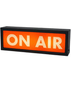 Rectangular sign with 'ON AIR' text on an orange background