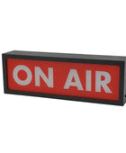 Rectangular sign with 'ON AIR' text on a red background