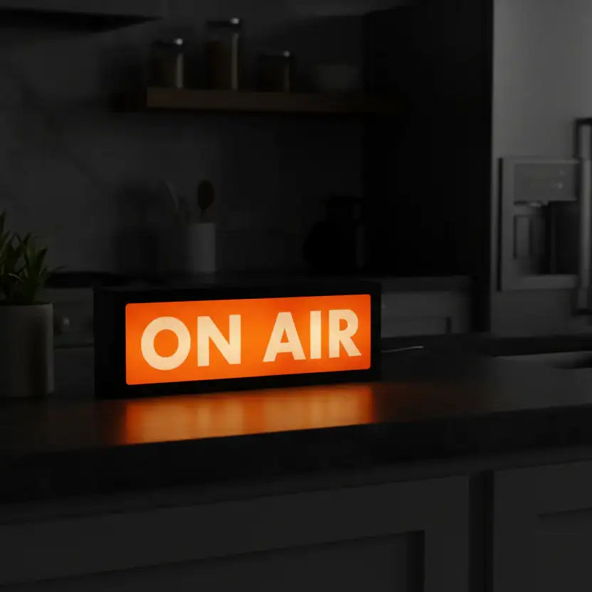 Digital sign displaying 'ON AIR' on a kitchen counter.