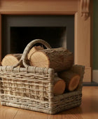 Wicker basket with logs in front of a fireplace