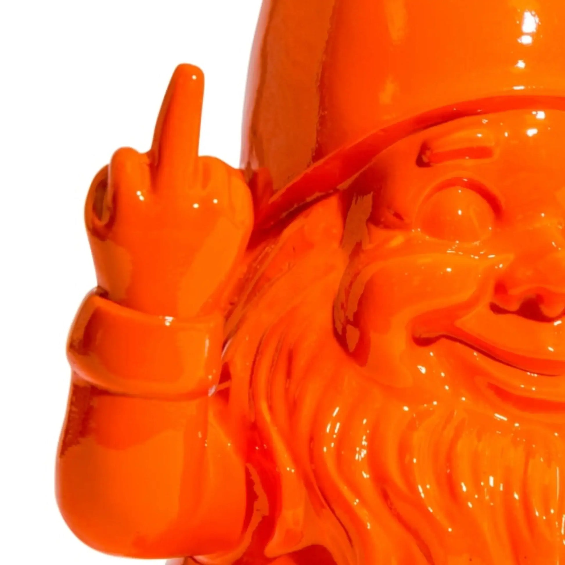Orange ceramic sculpture of a bearded figure giving the middle finger on a white background