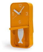 Orange wall clock with fish design on a white background